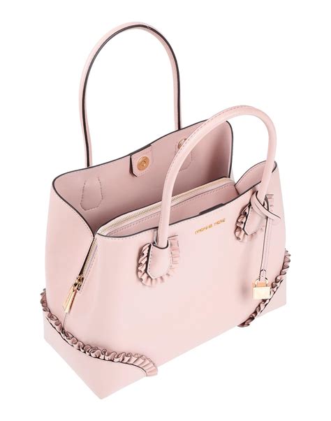 michael kors light pink handbag|pink michael kors outlet.